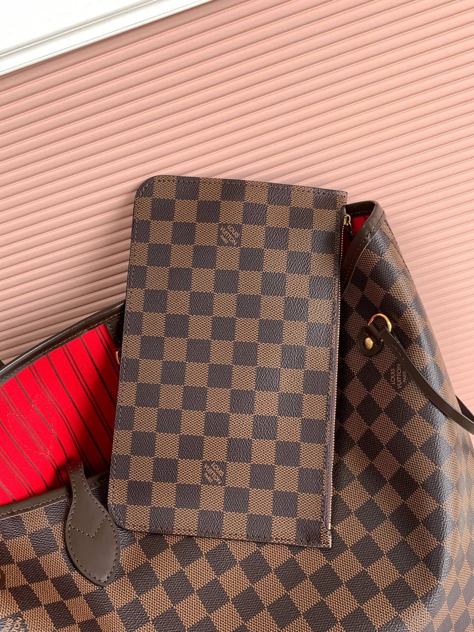 LV brown handbag with red inside