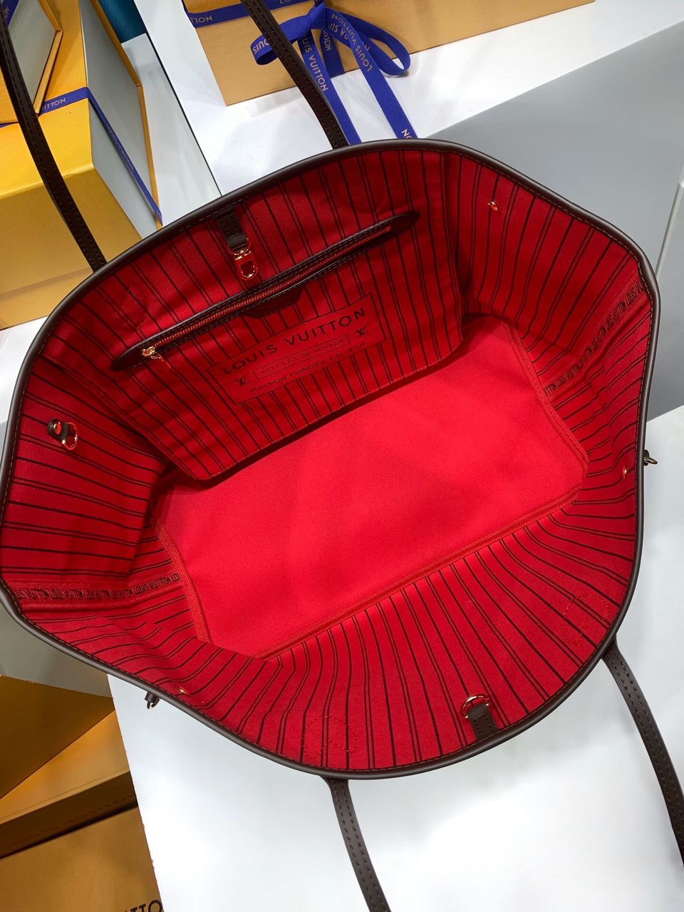 LV brown handbag with red inside