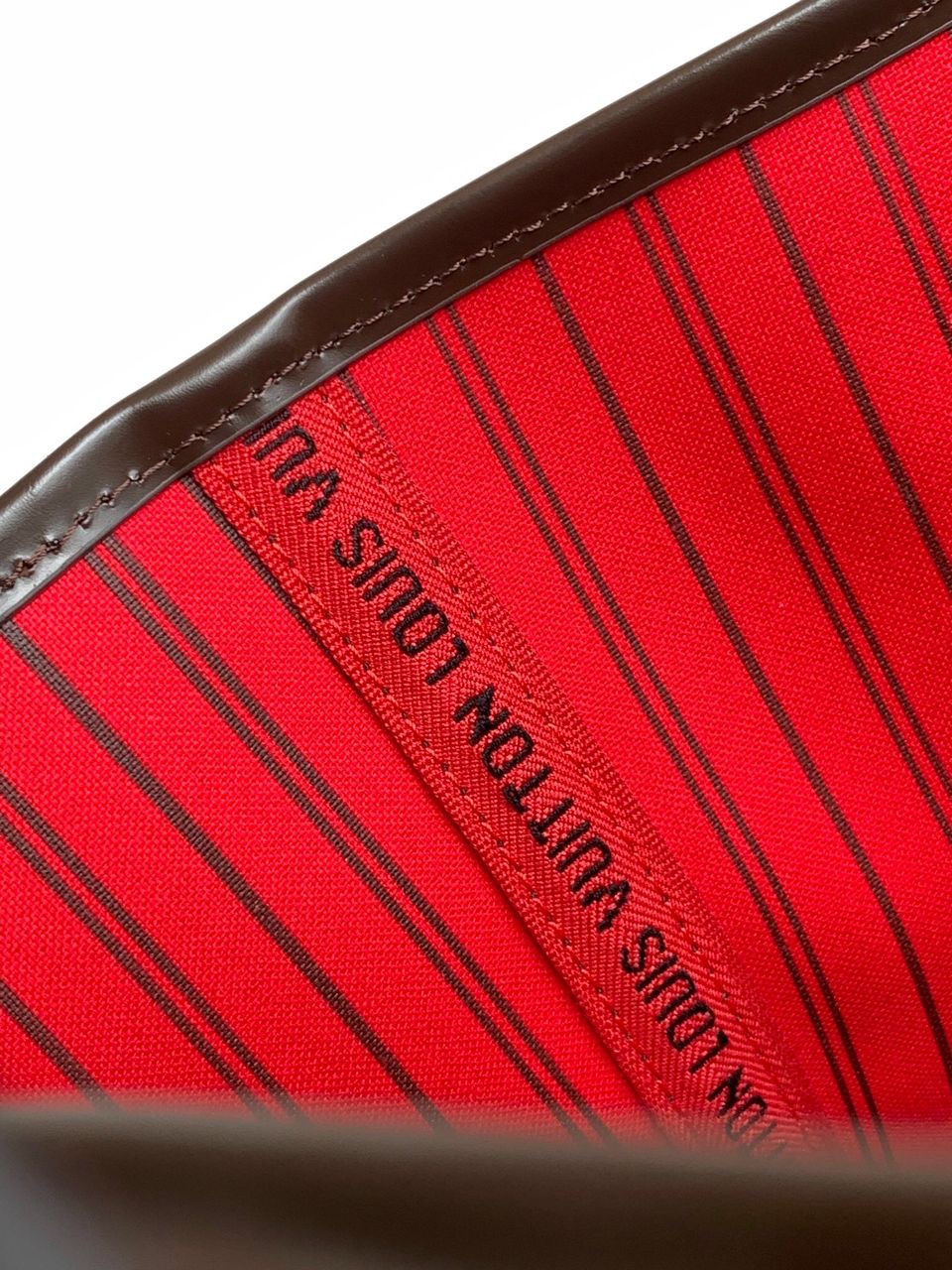 LV brown handbag with red inside