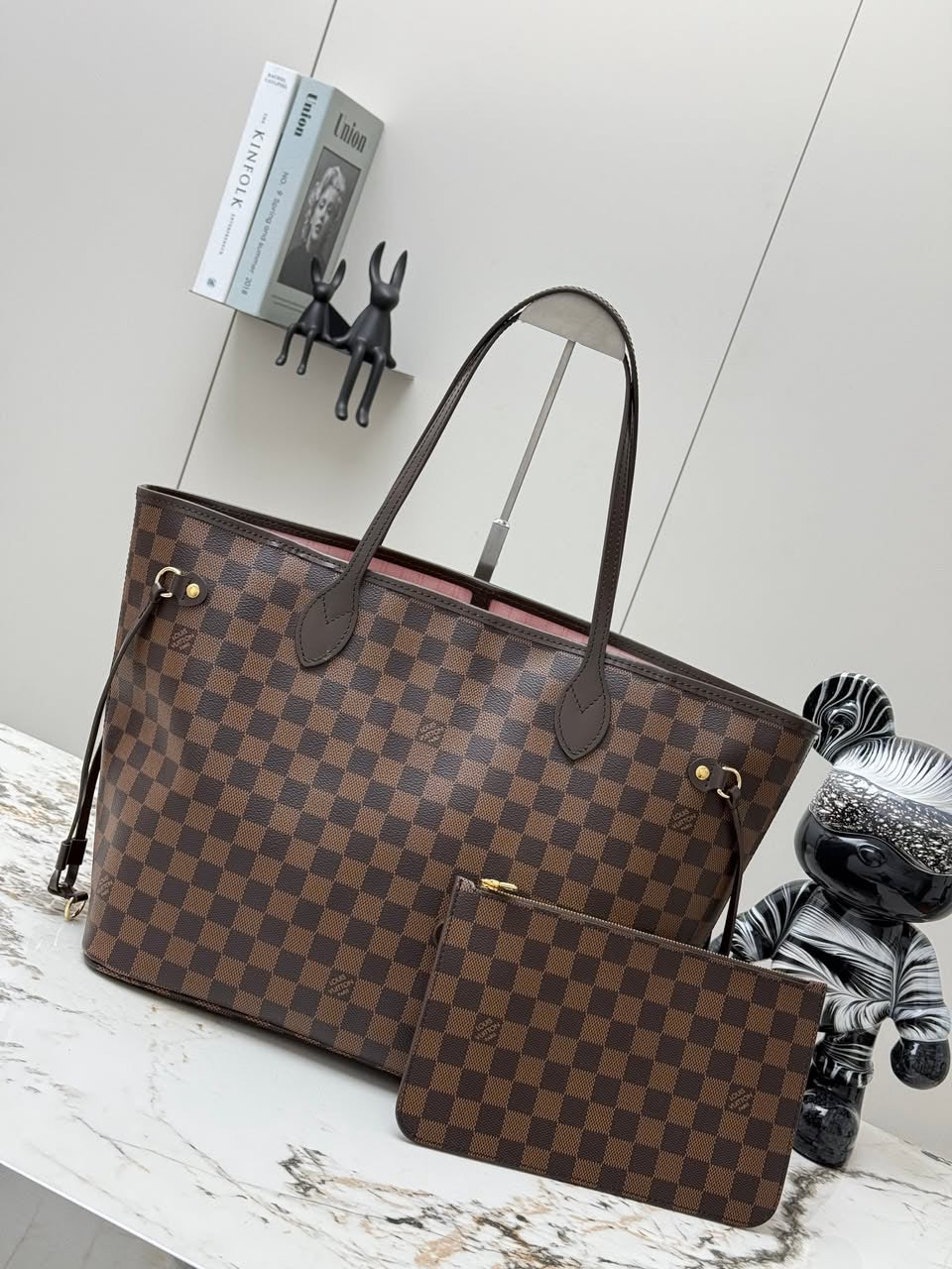 LV brown handbag with pink inside