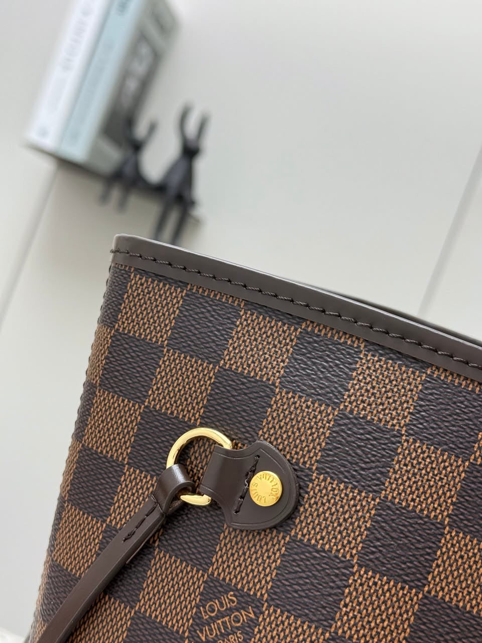 LV brown handbag with pink inside