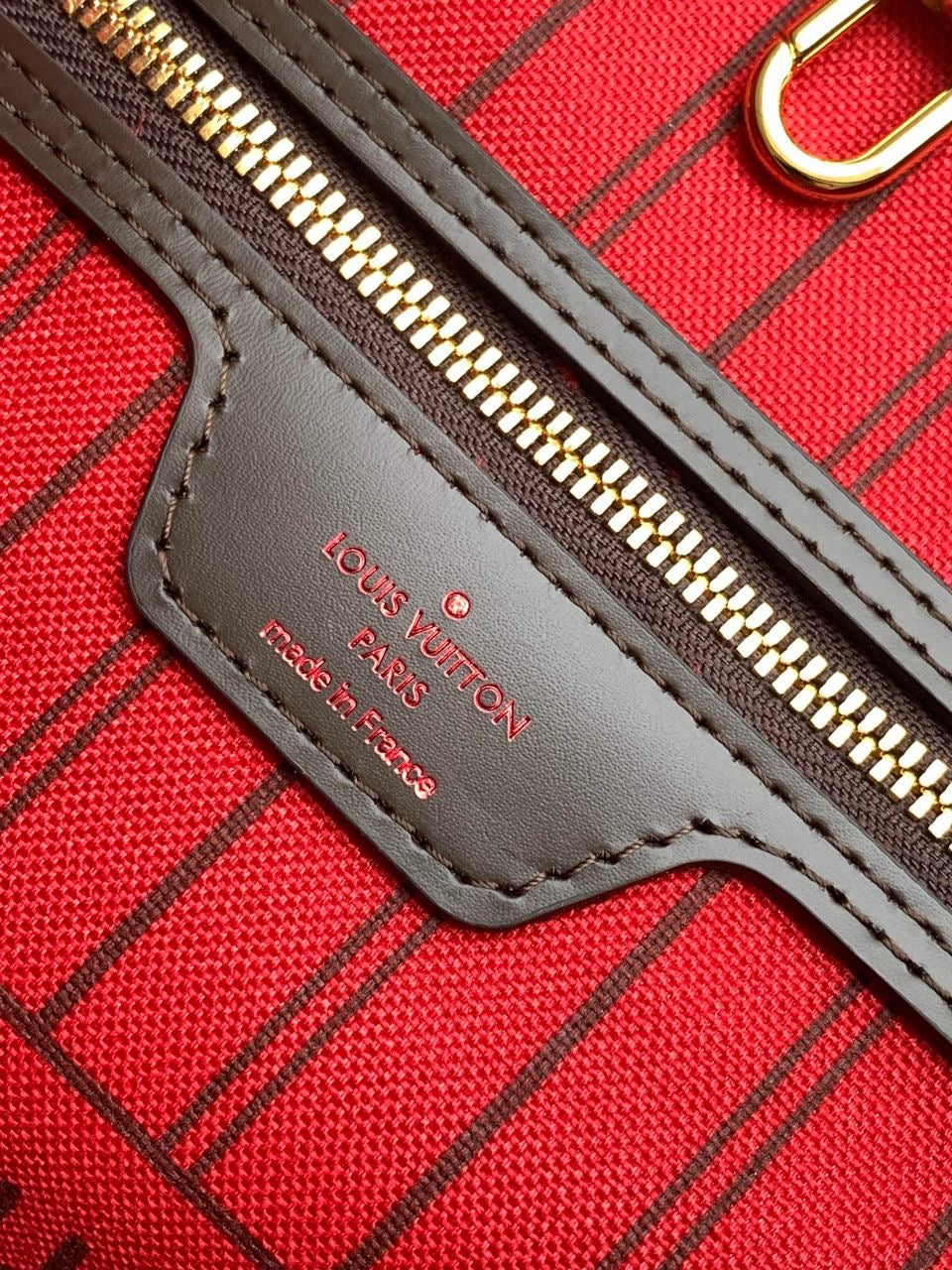 LV brown handbag with red inside