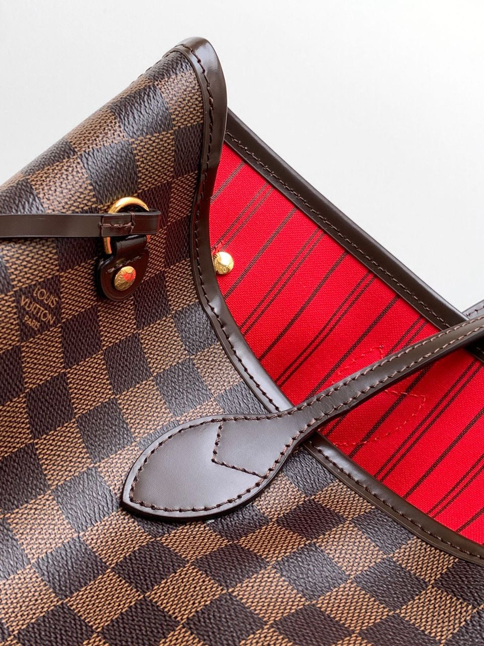 LV brown handbag with red inside