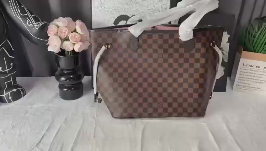LV brown handbag with pink inside